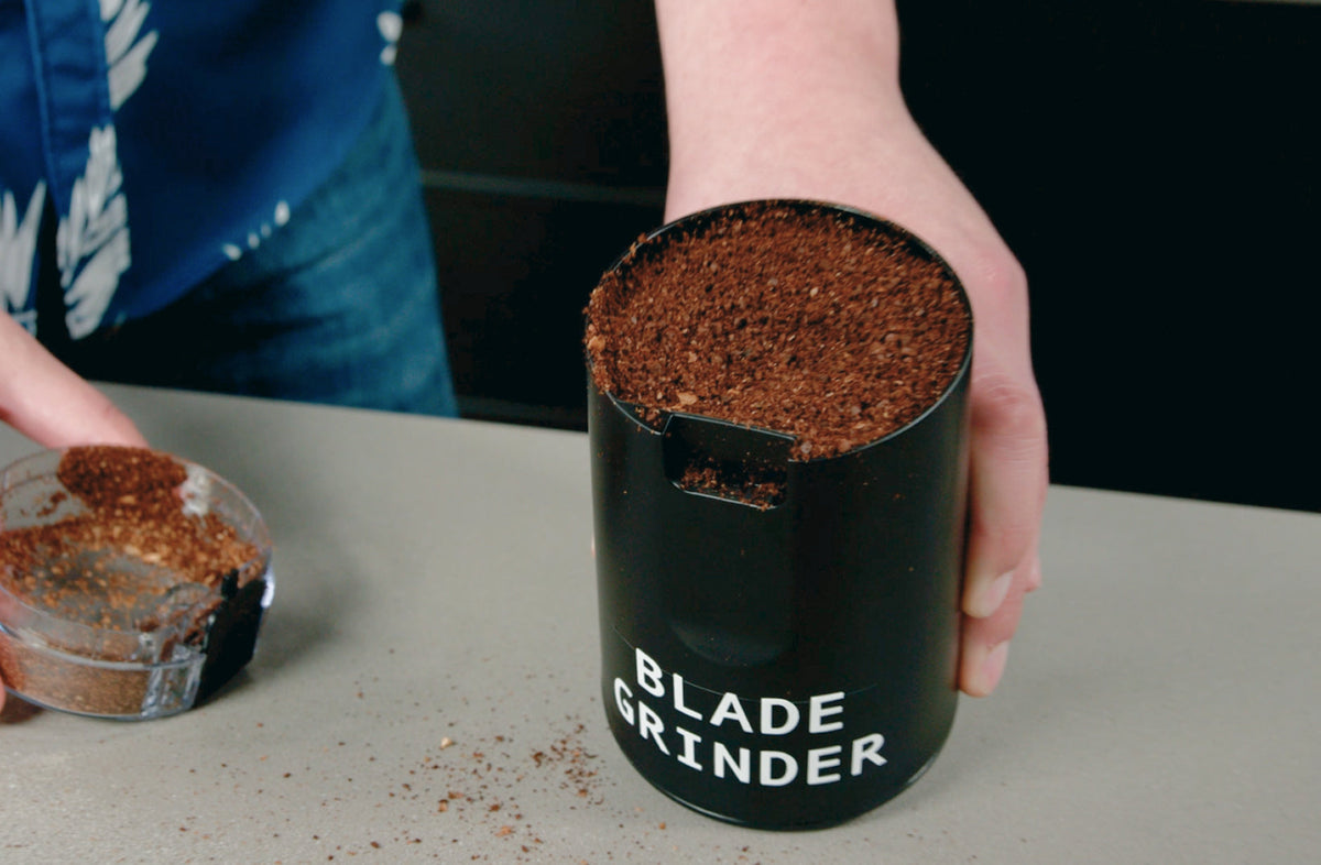 Blade grinder filled with unevenly ground coffee, showing inconsistent grind size - Seattle Coffee Gear